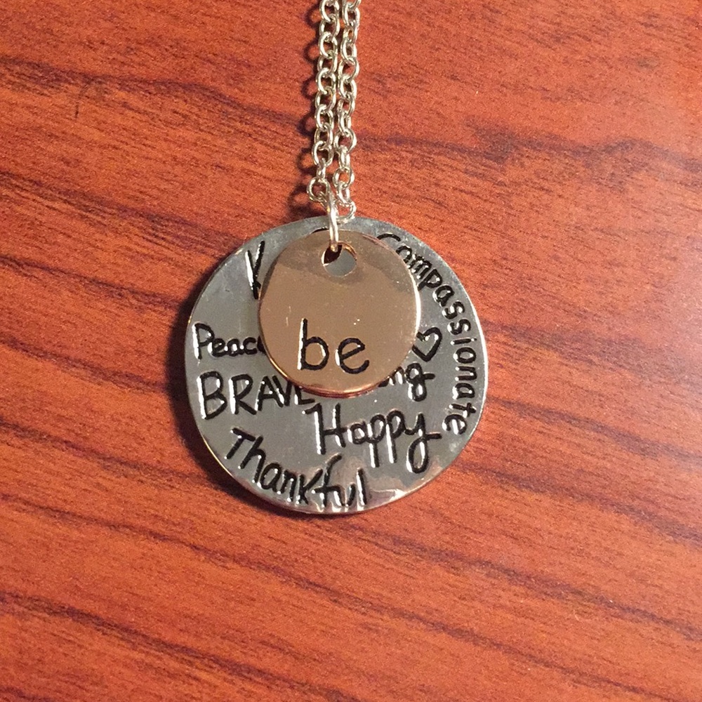 Silver/copper metal necklace with message.